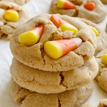 Candy Corn Peanut Butter Cookies | Candy Corn Cookies are a fun and delicious Halloween recipe. Soft-baked sweet peanut butter cookies with candy corn on top! Kids love to help push the candy corn on top the cookies!