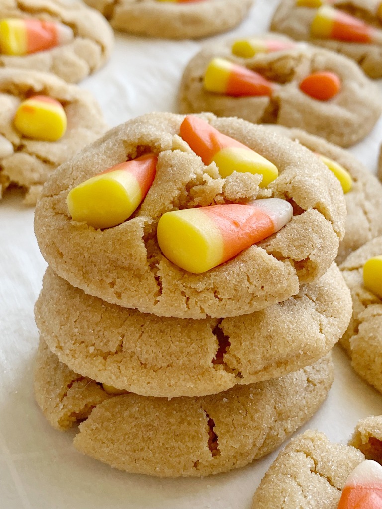 Candy Corn Peanut Butter Cookies | Candy Corn Cookies are a fun and delicious Halloween recipe. Soft-baked sweet peanut butter cookies with candy corn on top! Kids love to help push the candy corn on top the cookies!