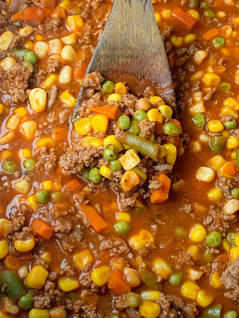 Vegetable Beef Soup only needs one pot and 30 minutes on the stove. Ground beef, frozen vegetables, tomato sauce, beef broth, and a couple surprise ingredients make this vegetable beef soup so delicious & easy to make!