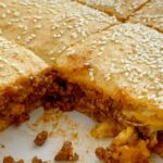 Sloppy Joe recipe made into a casserole and sandwiched between two layers of buttery refrigerated biscuits. Quick and simple to make, your family will love this sloppy joe casserole.