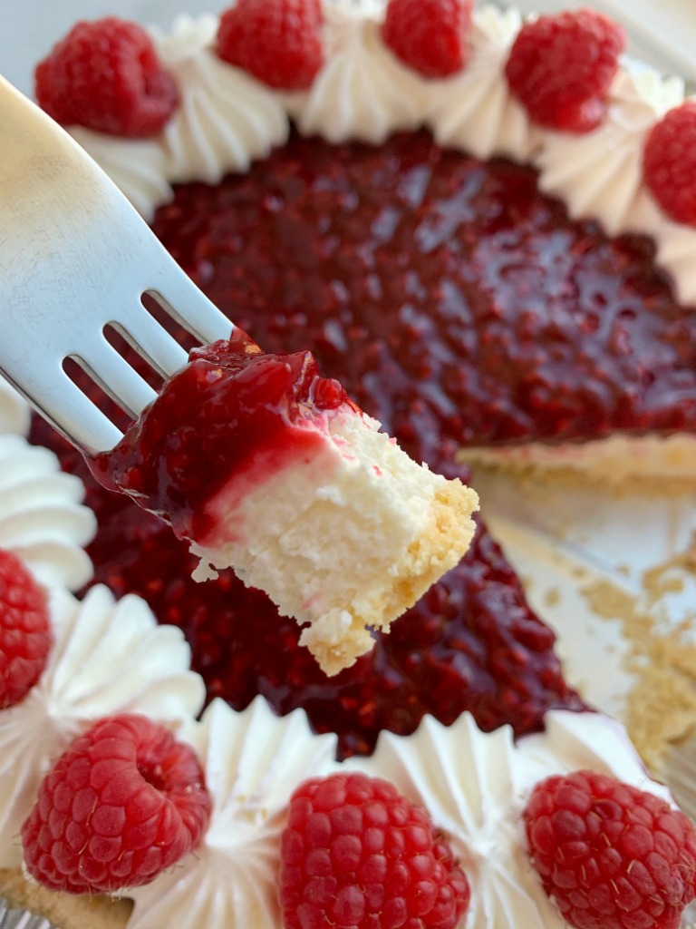 Raspberry Cream Pie has a sweet, cheesecake layer topped by a fresh raspberry layer inside an easy and convenient store-bought graham cracker crust!