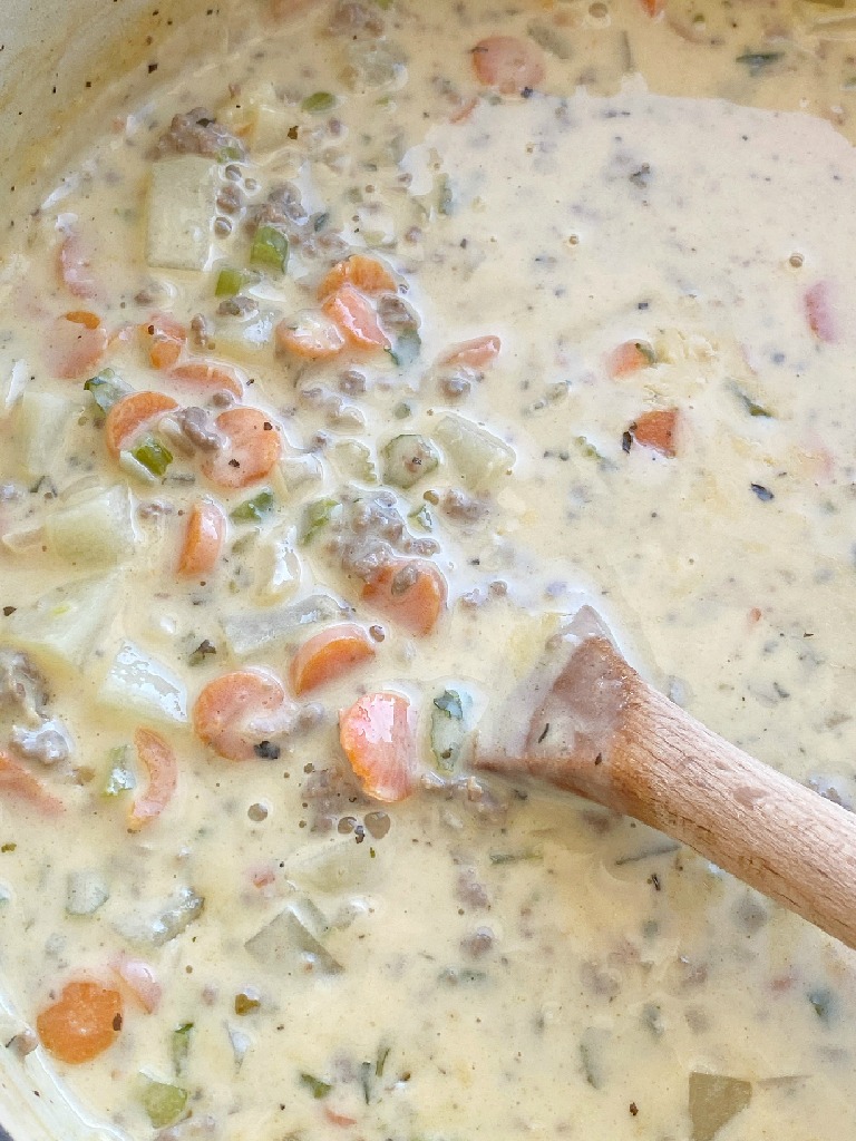 Cheeseburger Soup is a creamy & cheesy soup with seasoned ground beef, vegetables, and potatoes! Tastes just like a cheeseburger but in a delicious soup recipe. 
