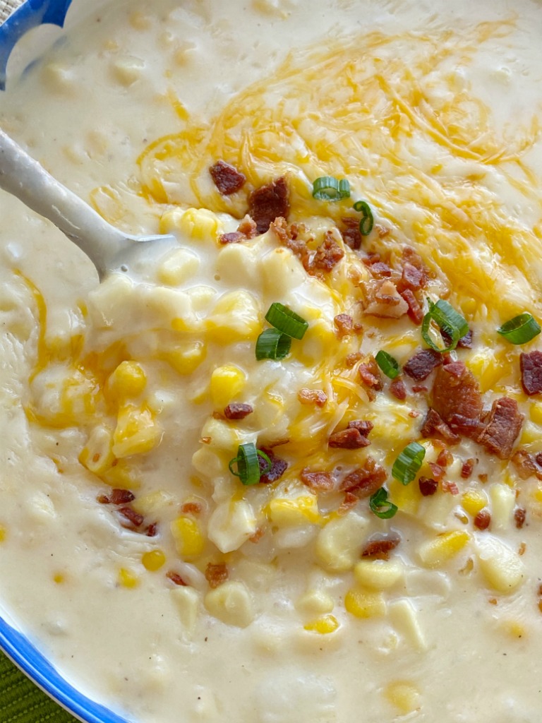 Potato Corn Chowder made in the Instant Pot! Frozen corn, chopped potatoes, and cheese in a creamy chicken broth base. Serve with shredded cheese, bacon, and green onions.