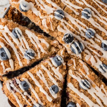 Overhead pic of the baked coffee cake with fresh blueberries and a glaze.