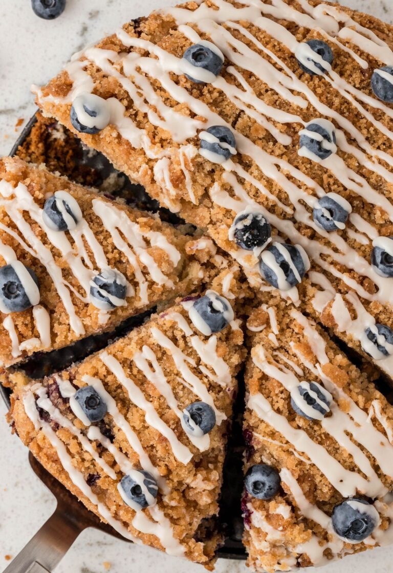 Overhead pic of the baked coffee cake with fresh blueberries and a glaze.