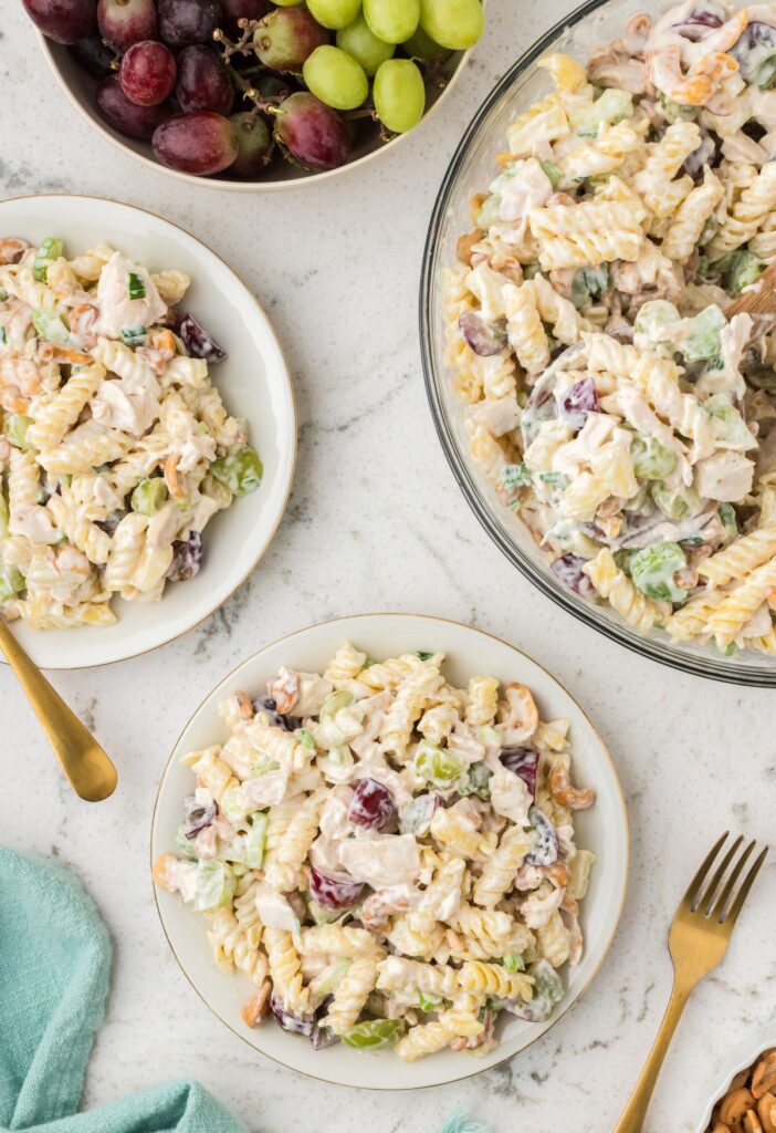 top view of the bowl of pasta salad and a serving plate of it