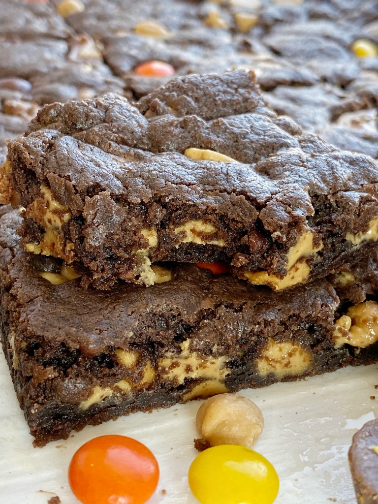 TRIPLE FUDGE REESE'S BROWNIES start with a cake mix and only 4 other ingredients! Rich, chocolatey, peanut butter and chocolate brownies that are so easy & simple to make.