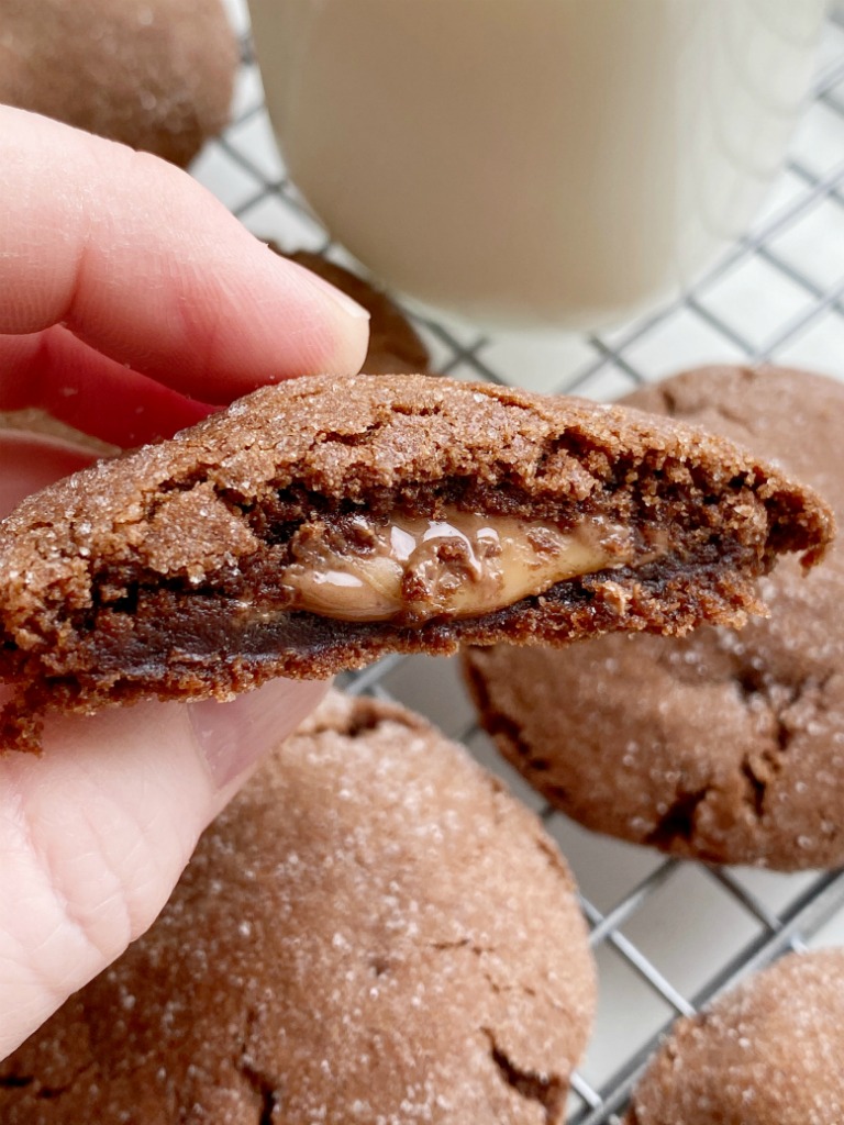 Rolo Cookies will cure any chocolate craving! Soft-baked, thick & chewy chocolate cookie stuffed with a caramel chocolate Rolo candy.