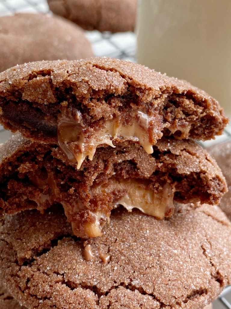 Rolo Cookies will cure any chocolate craving! Soft-baked, thick & chewy chocolate cookie stuffed with a caramel chocolate Rolo candy.