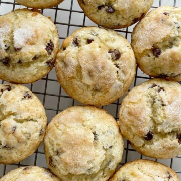 Chocolate Chip Banana Muffins bake up perfectly tall and round, soft-baked banana muffins, with chocolate chips and a sprinkle of sugar on top. You will love how soft and beautiful these banana muffins are!