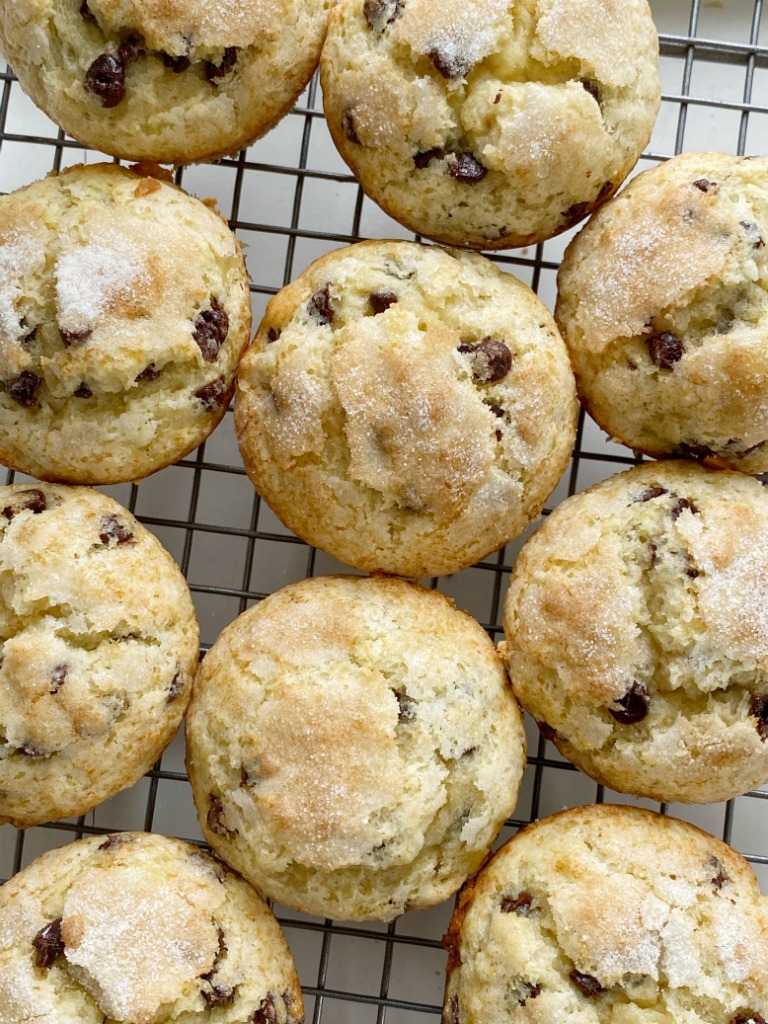 Chocolate Chip Banana Muffins bake up perfectly tall and round, soft-baked banana muffins, with chocolate chips and a sprinkle of sugar on top. You will love how soft and beautiful these banana muffins are!