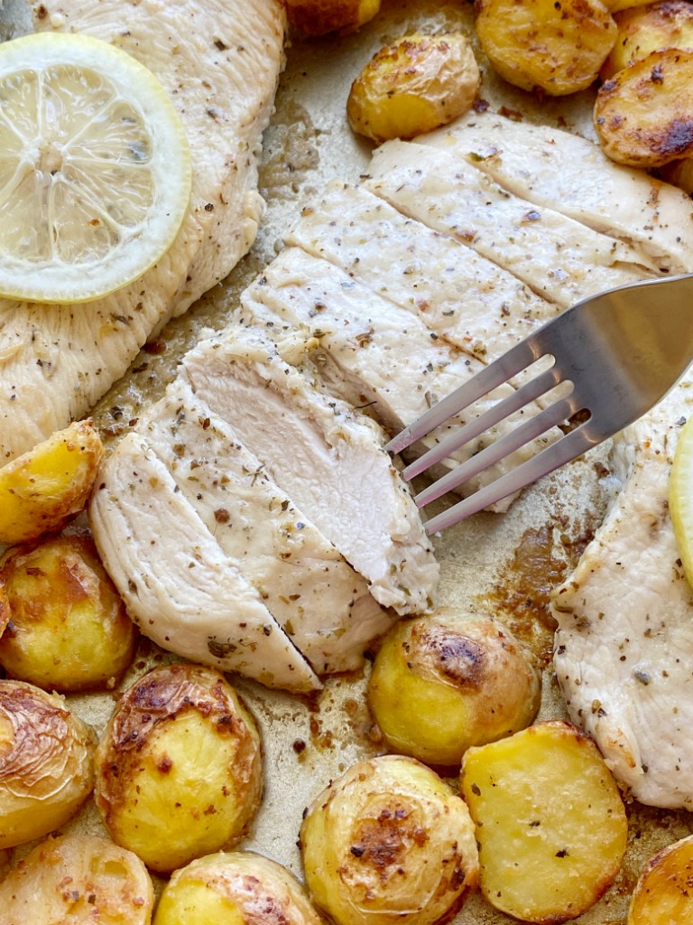 Lemon Chicken and Potatoes is a one sheet pan dinner recipe with crispy, soft lemon parmesan potatoes and juicy lemon garlic chicken breasts.