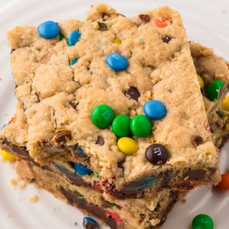 Top view of a stack of cookie bars with a bite taken out of the top bar.