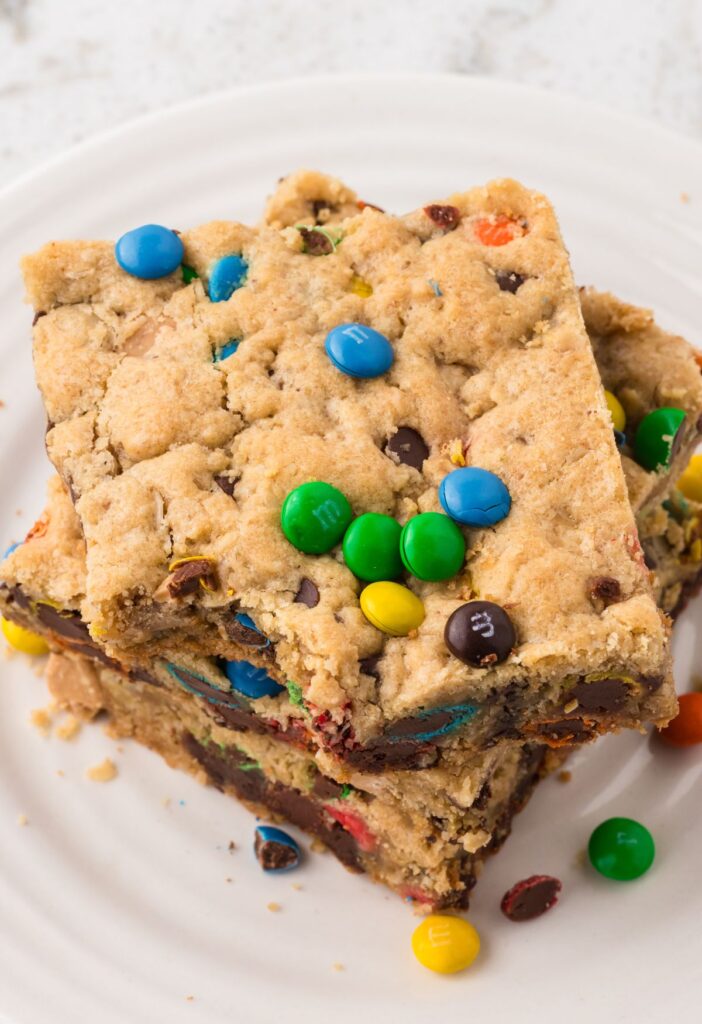 Top view of a stack of cookie bars with a bite taken out of the top bar. 