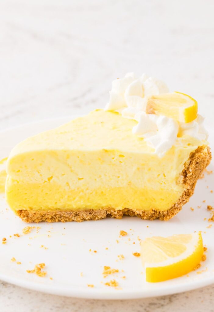 Side view of the slice of lemon pie with the triple layers