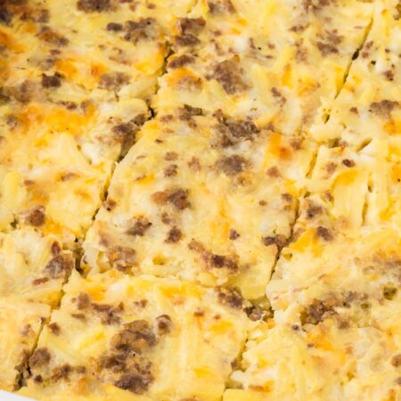 A white casserole dish with a breakfast casserole inside.