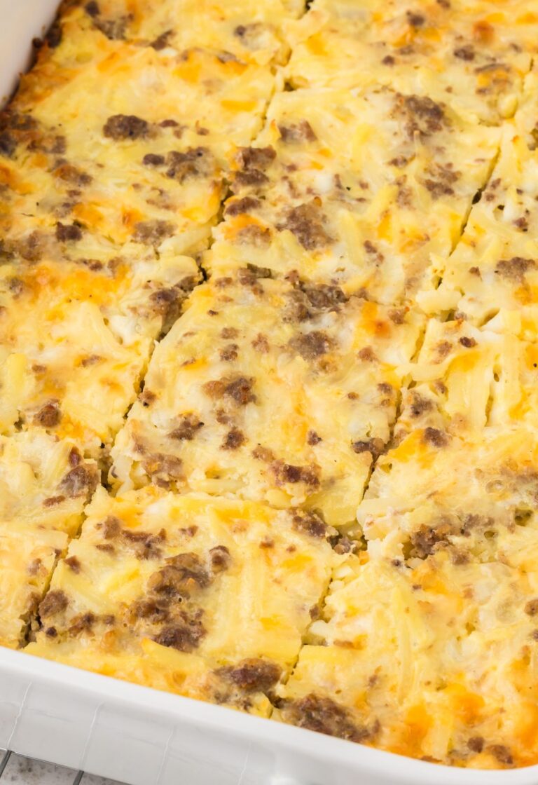 A white casserole dish with a breakfast casserole inside.