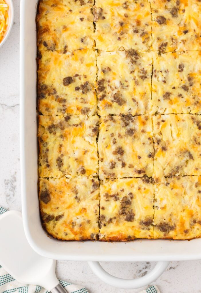 Ground breakfast sausage casserole in a white casserole dish. 
