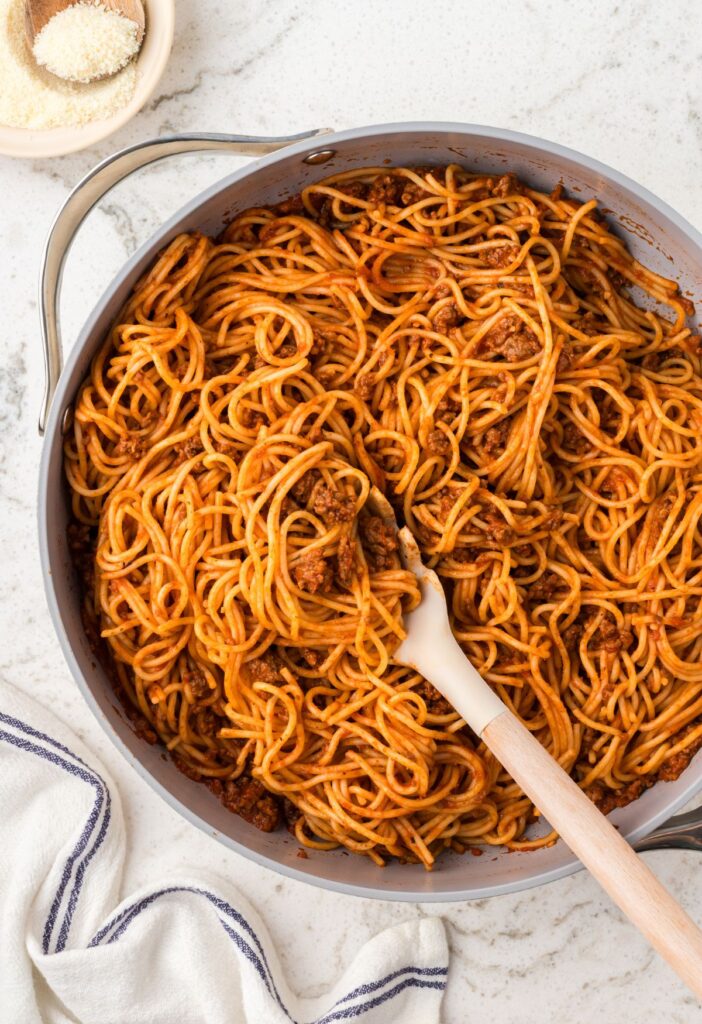 Top view of the skillet pan of spaghetti inside of it