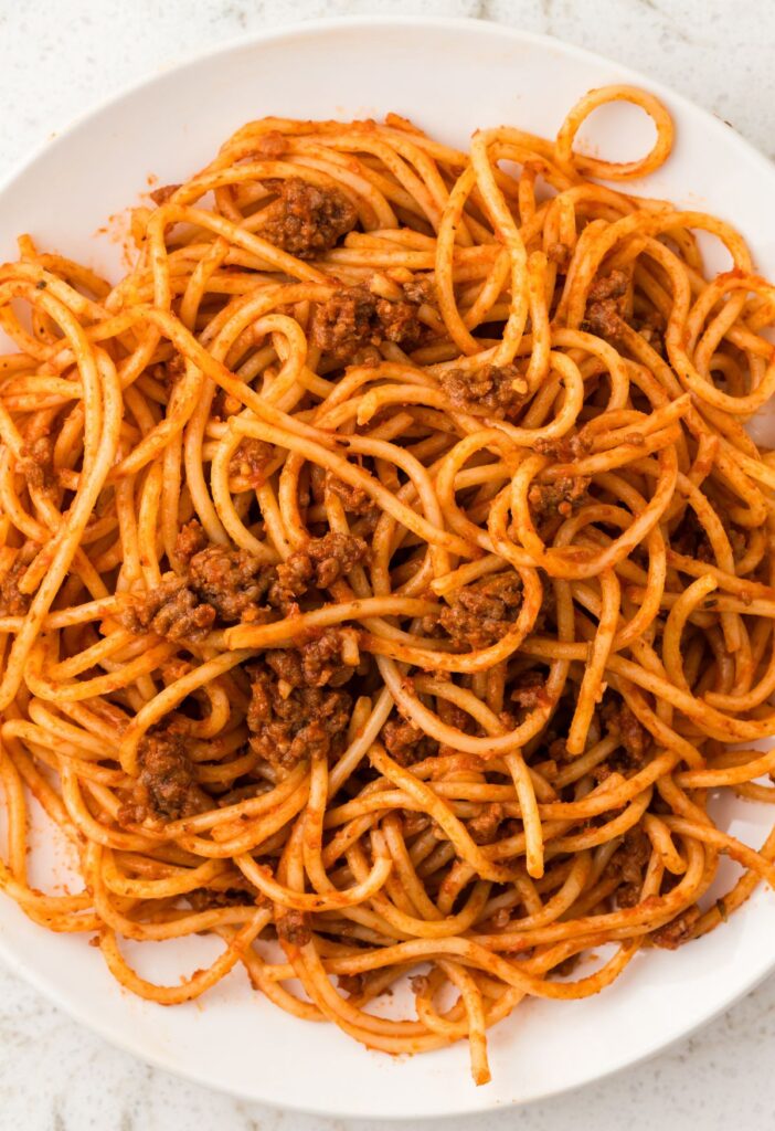 A white plate of spaghetti