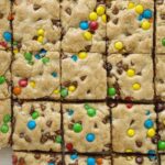 Chocolate Chip Cookie Bars are thick, chewy, soft-baked and absolutely perfect and bake up in one pan. Load them up with anything you want; chocolate chips, m&m's, chopped candy bar pieces, and even some pecans.