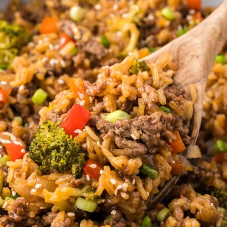 A skillet pan with a wooden spoon