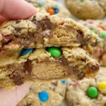 Reese's Stuffed Monster Cookies are monster cookies loaded with oats, peanut butter, chocolate chips, m&m's and stuffed with a Reese's miniature in the center! So soft, thick, chewy, and just the best cookie ever.