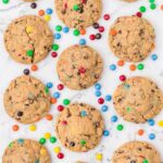 Cookies with m&m candies around them on a white background