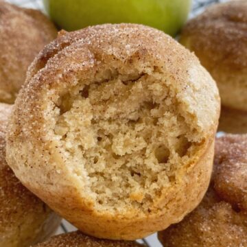 Cinnamon Applesauce Muffins are so fluffy & soft! Made with cinnamon applesauce, warm cinnamon, and topped with a buttery cinnamon & sugar topping. These muffins always disappear fast.