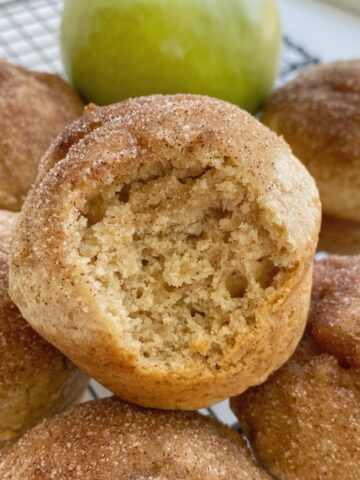 Cinnamon Applesauce Muffins are so fluffy & soft! Made with cinnamon applesauce, warm cinnamon, and topped with a buttery cinnamon & sugar topping. These muffins always disappear fast.