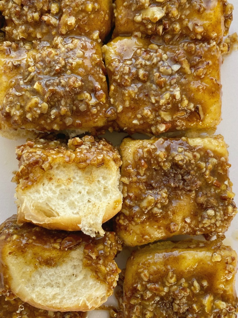 Easy Overnight Pumpkin Spice Sticky Buns are so quick & simple to make thanks to frozen bread rolls. Make them the night before and let it rise all night. Bake up a pan of caramel-y, gooey, pumpkin spice sticky buns with a pecan topping in the morning for a delicious breakfast treat. 