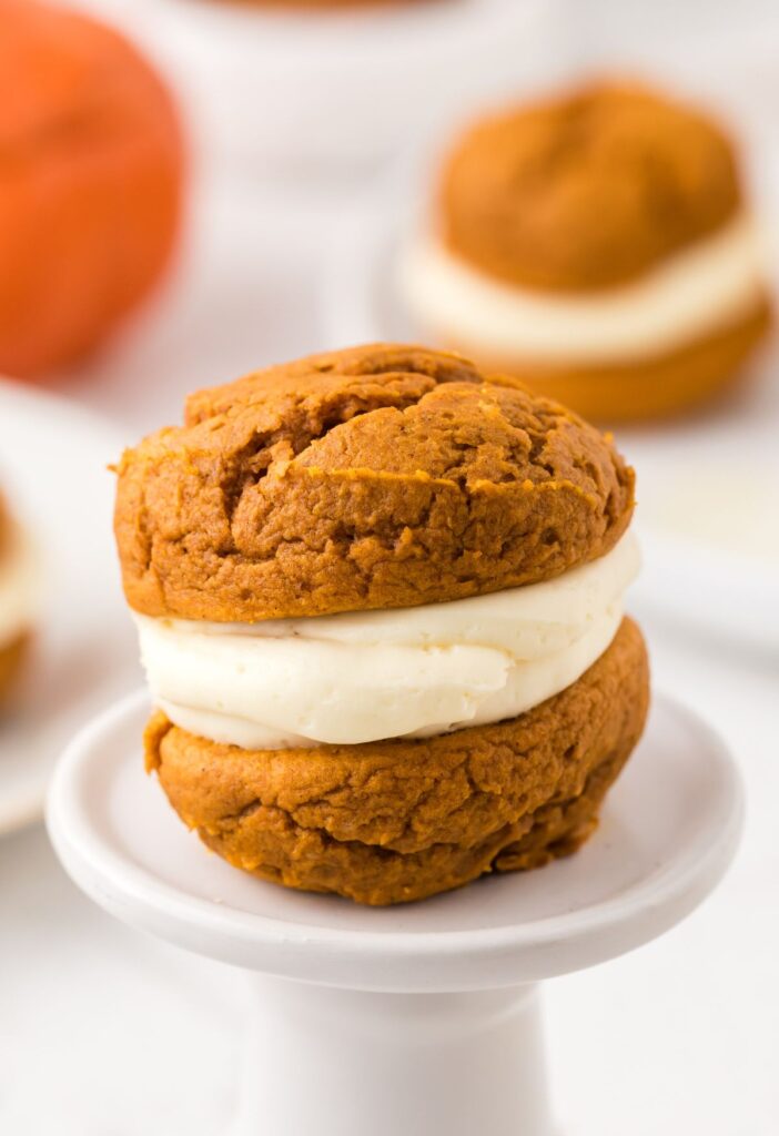 Hero shot for pumpkin whoopie pies with a cheesecake filling.