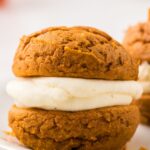 One whoopie pie sitting a white plate