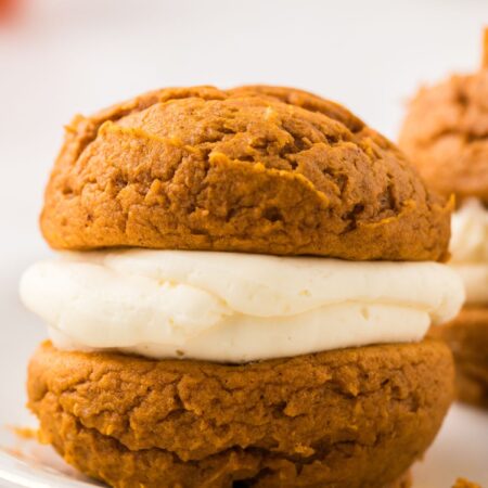 One whoopie pie sitting a white plate