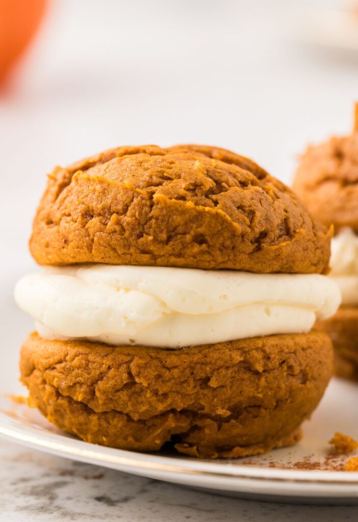 One whoopie pie sitting a white plate