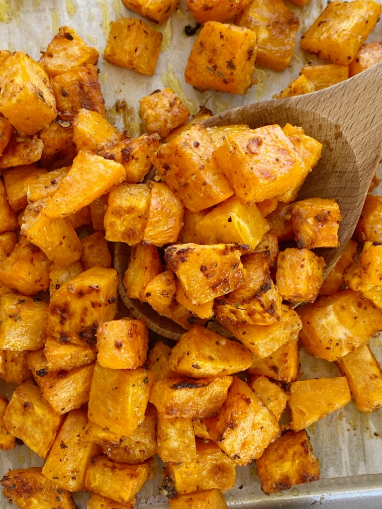 Roasted Garlic Parmesan Sweet Potatoes are roasted in butter, olive oil, parmesan cheese, and seasonings. A crispy charred outside with a soft sweet potato center. One bowl and a few simple ingredients are all you need for this delicious side dish recipe.