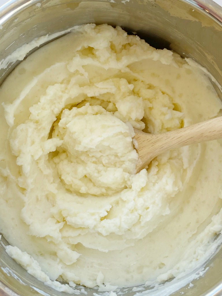 Instant Pot Mashed Potatoes are so fluffy, light, and easy to make right in the Instant Pot! Russet potatoes, whole milk, butter, sour cream, salt, and garlic pepper are all you need for this simple side dish recipe. Or use in any recipe that calls for mashed potatoes.