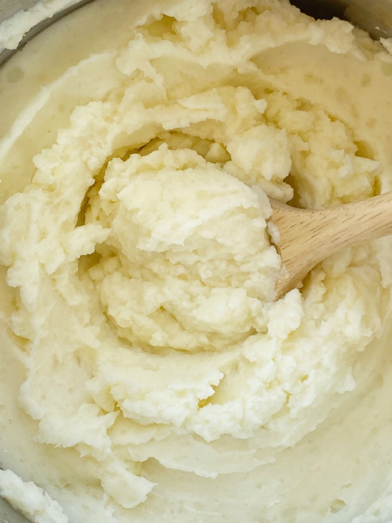 Instant Pot Mashed Potatoes are so fluffy, light, and easy to make right in the Instant Pot! Russet potatoes, whole milk, butter, sour cream, salt, and garlic pepper are all you need for this simple side dish recipe. Or use in any recipe that calls for mashed potatoes. 