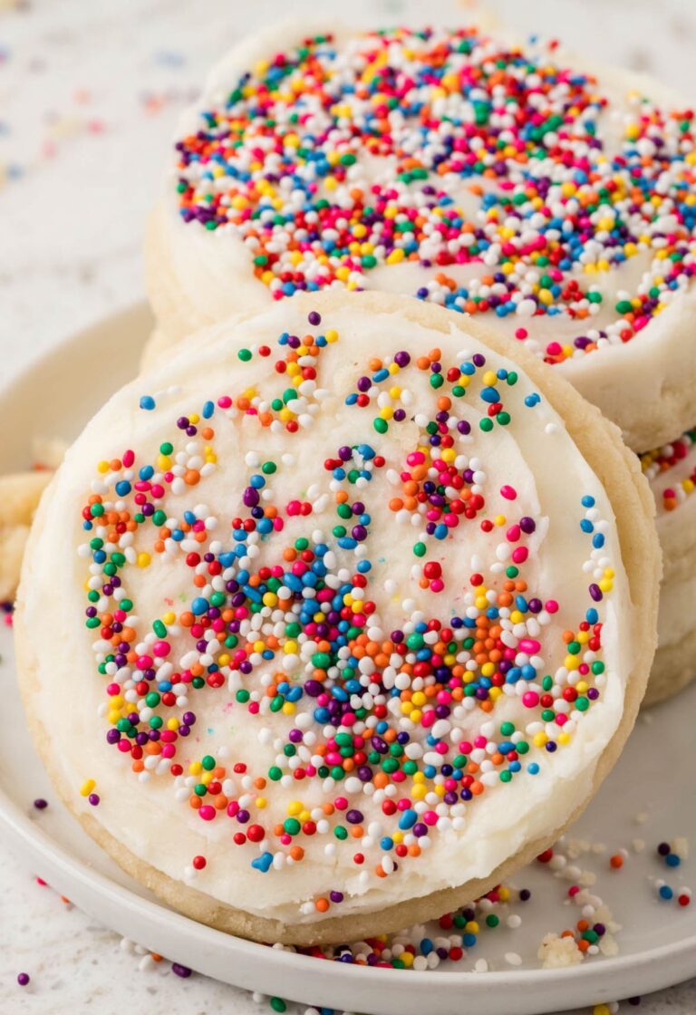 Stack of cookies with one sugar cookie leaning up against it