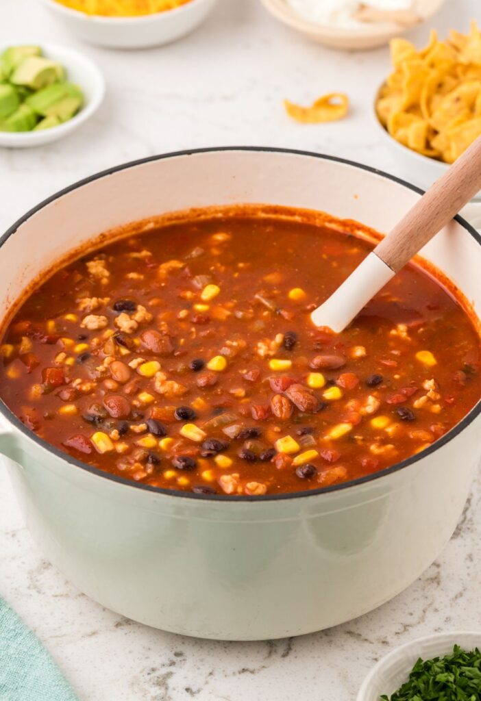 Pot of soup with a soup ladle in it