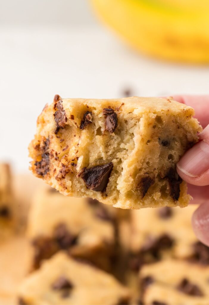 A hand holding a banana bar