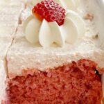Easy strawberry cake recipe inside a cake pan. This cake recipe uses a cake mix and jello mix.