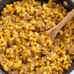 Recipe for homemade hamburger helper that is shown inside a skillet pan.