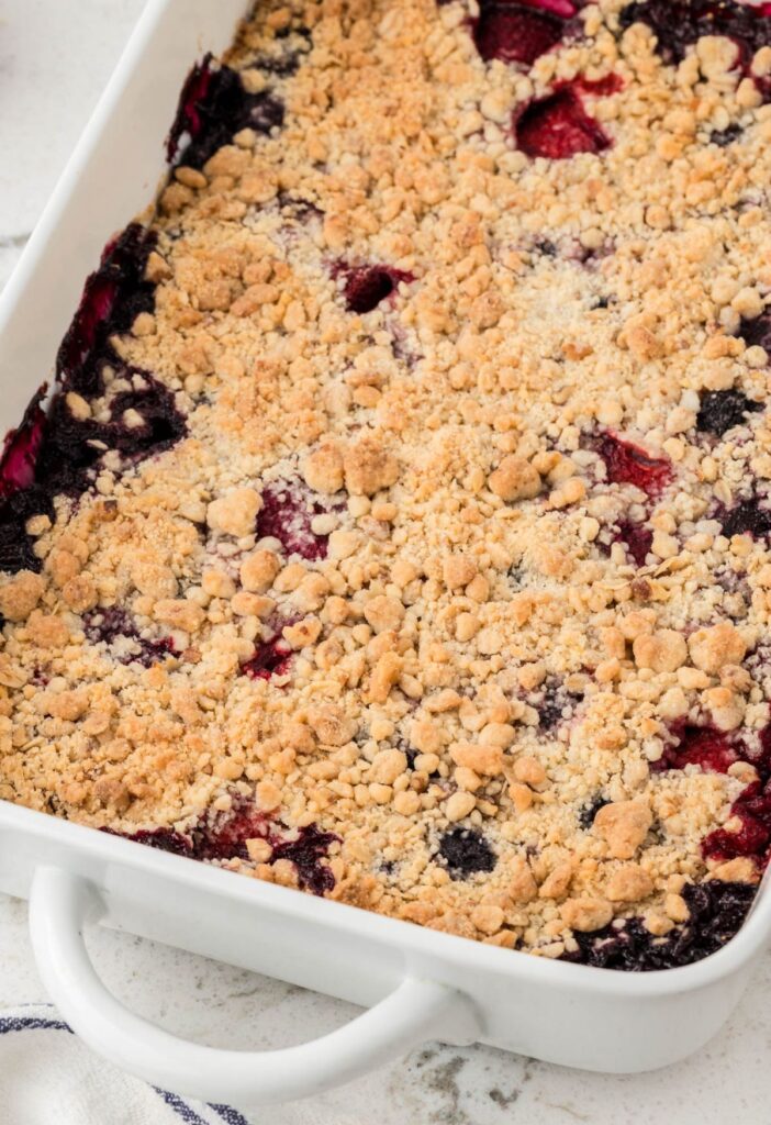 A pan of the baked berry crisp with a cake mix topping. 