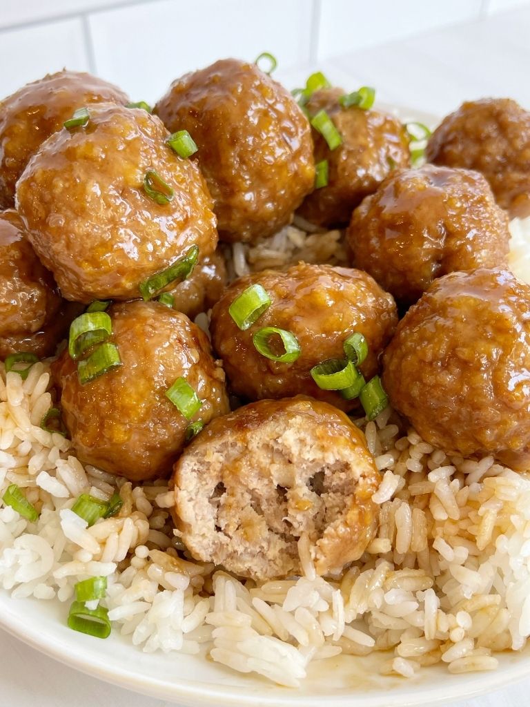Ground turkey meatballs topped with teriyaki sauce and green onions.