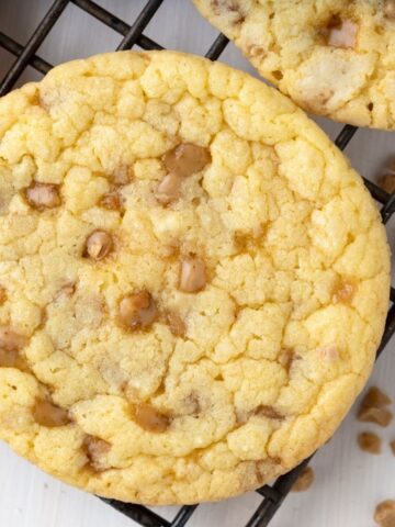 Close up photo of a toffee cookies with cake mix and toffee bits.