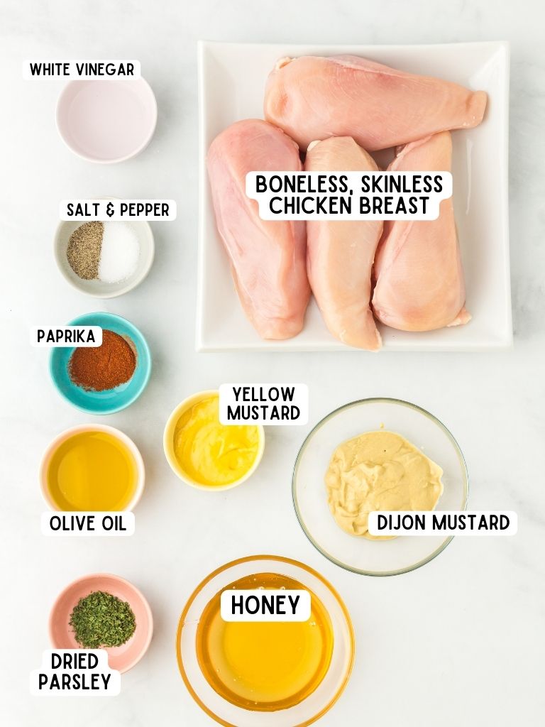 Ingredients needed to make this chicken recipe with each one labeled in black text. 