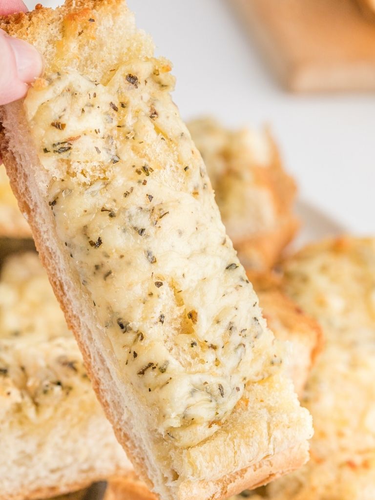 Cheesy garlic bread stick with a close up shot. 