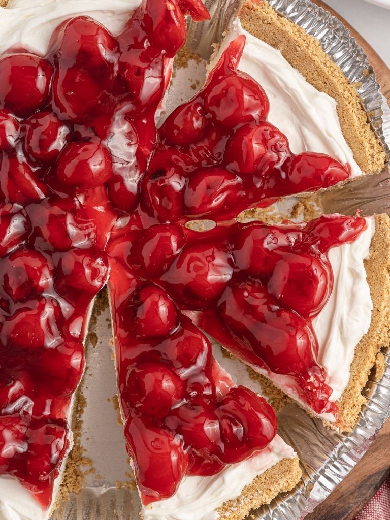 Overhead shot of cheesecake pie in a graham cracker crust.