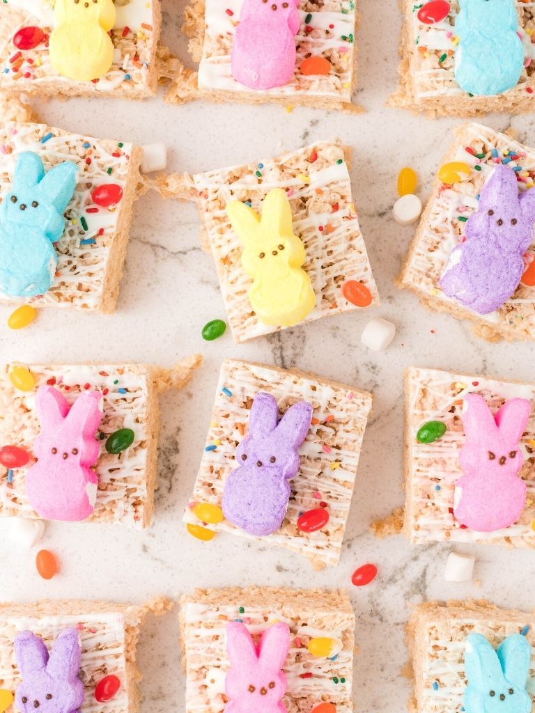 Overhead shot of peeps Krispie treats with jelly beans on the background.